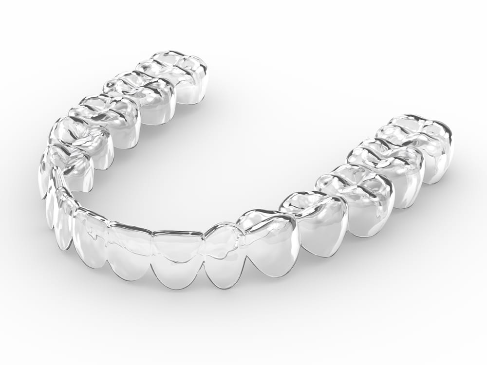 Clear aligner for teeth straightening on a white background