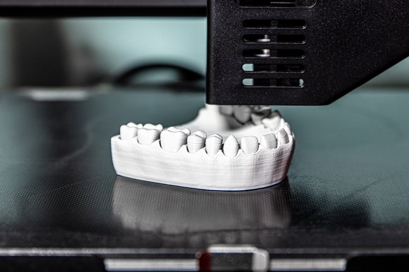 3D printer creating a detailed dental model of teeth and gums